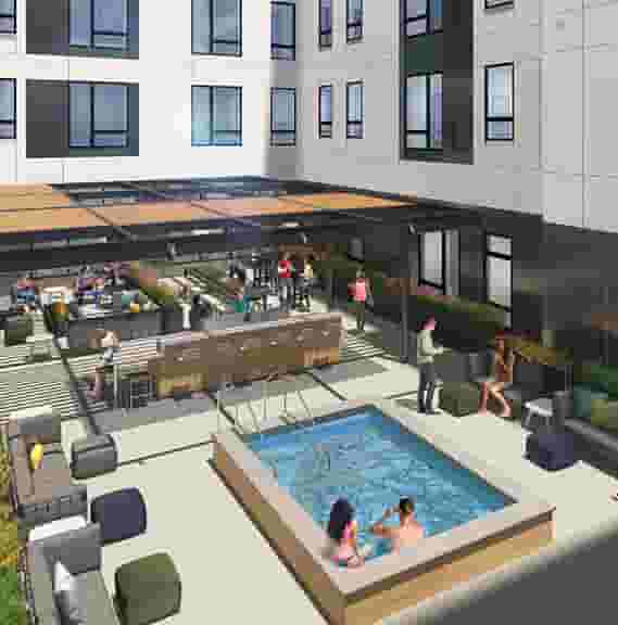 Aerial View of Courtyard with Hot Tub, TVs, Grills, and Lounge